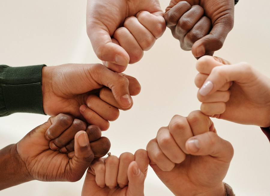 Fists of people with different skin tone