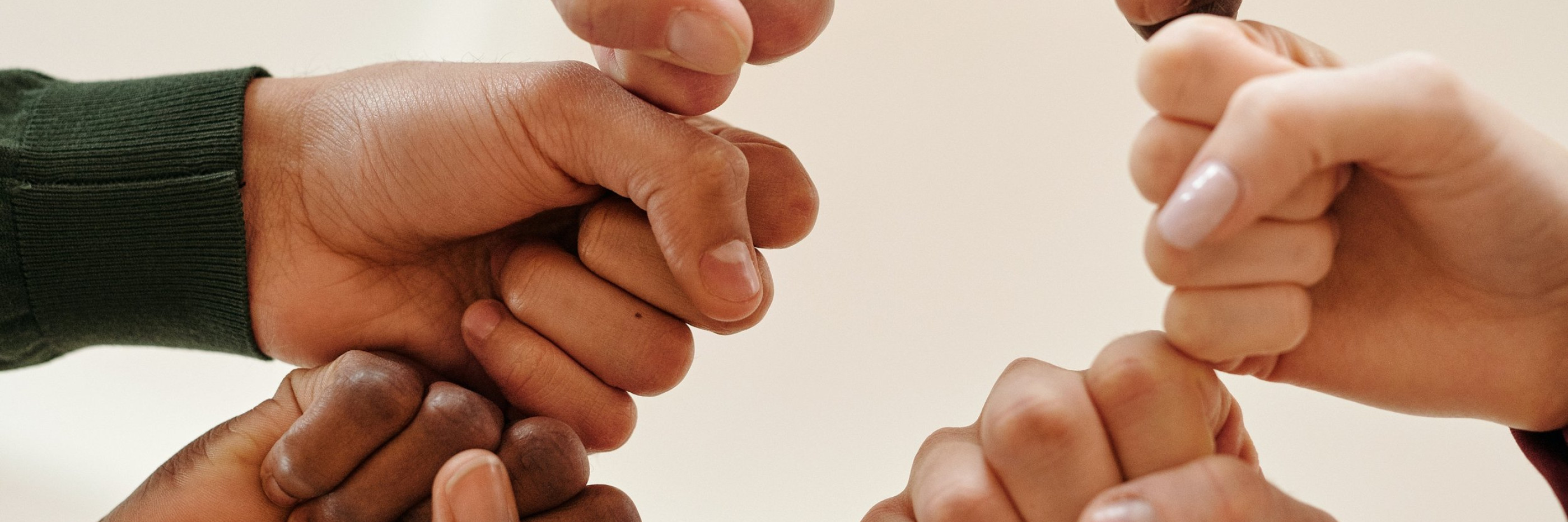 Fists of people with different skin tone