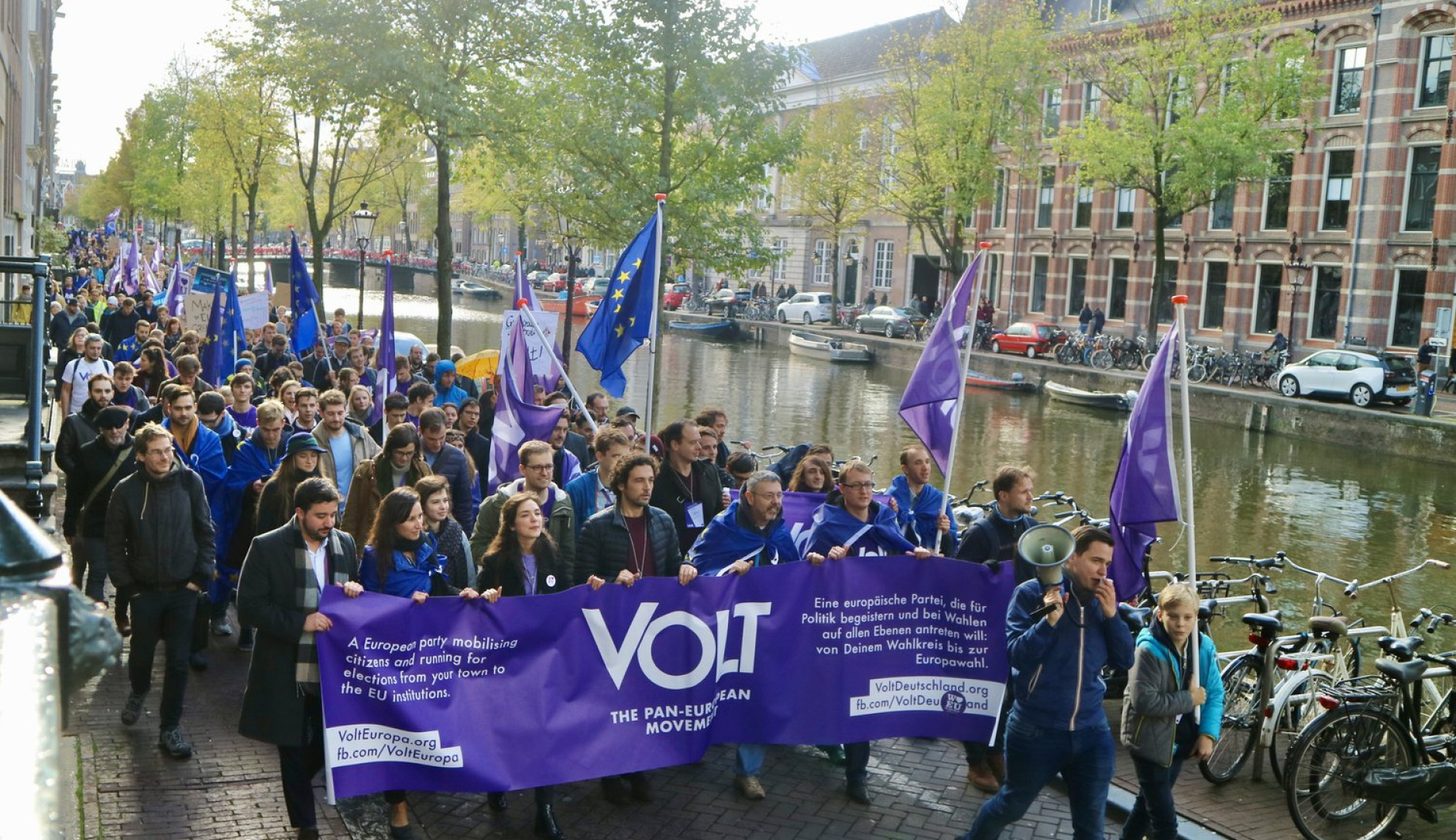 Volt parade in Amsterdam with flag