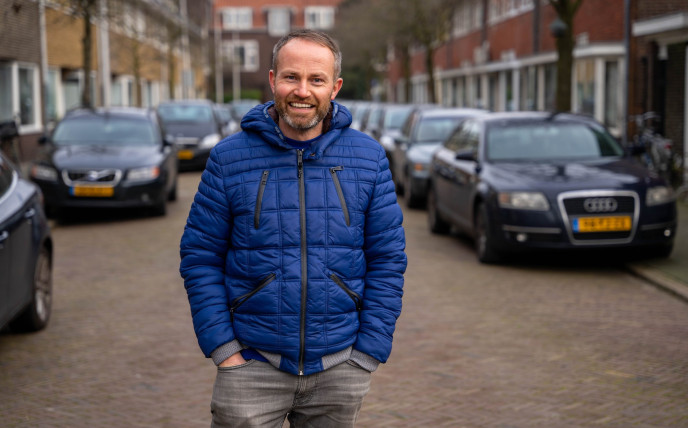 Guy with blue jacket on a street